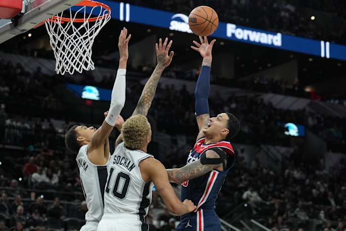 Washington Wizards forward Kyle Kuzma (33) shoots over San Antonio Spurs center Victor Wembanyama (1) and forward Jeremy Sochan (10) in the second half at Frost Bank Center. Mandatory Credit: Daniel Dunn-USA TODAY Sports